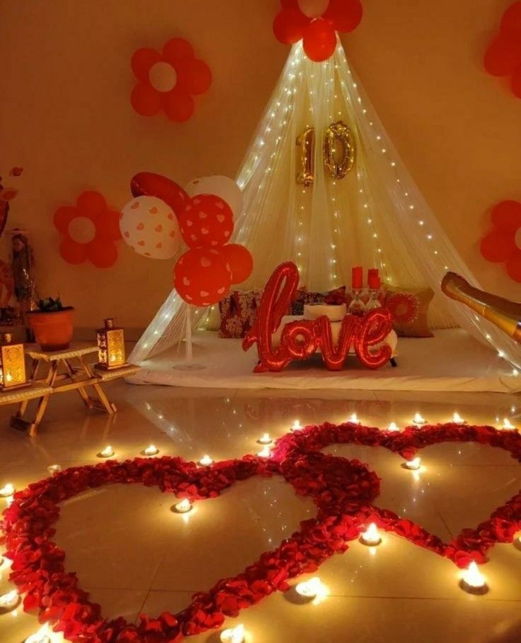 Romantic surprise setup with candles and rose petals